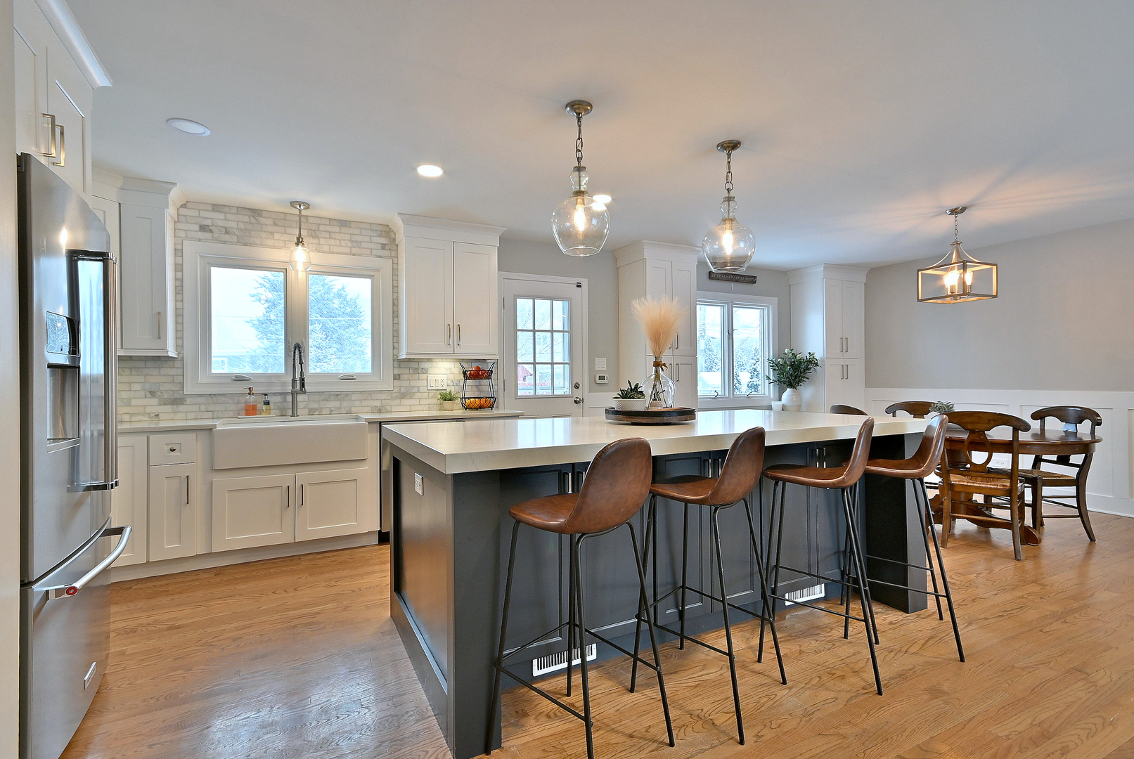 366 Marion Street Elmhurst, IL 60126 - Photo 13 of 41 a large kitchen with lots of counter space and dining table