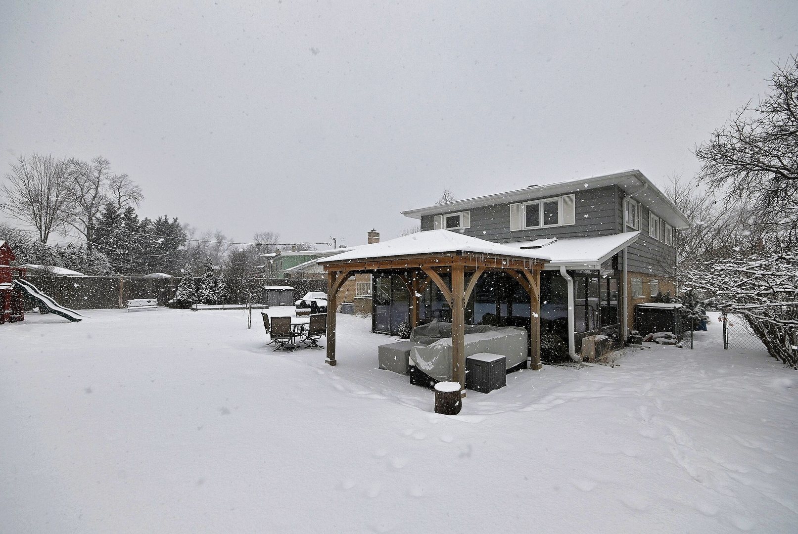 366 Marion Street Elmhurst, IL 60126 - Photo 30 of 41 a view of a patio with a table and chairs under an umbrella