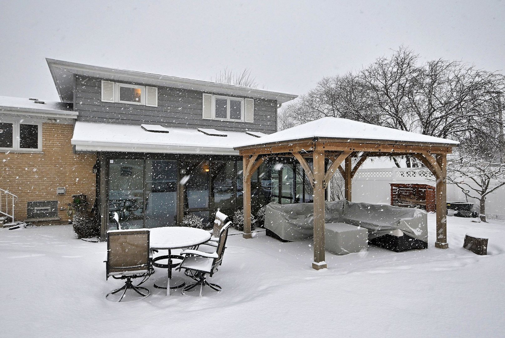 366 Marion Street Elmhurst, IL 60126 - Photo 33 of 41 a view of patio with table and chairs under an umbrella