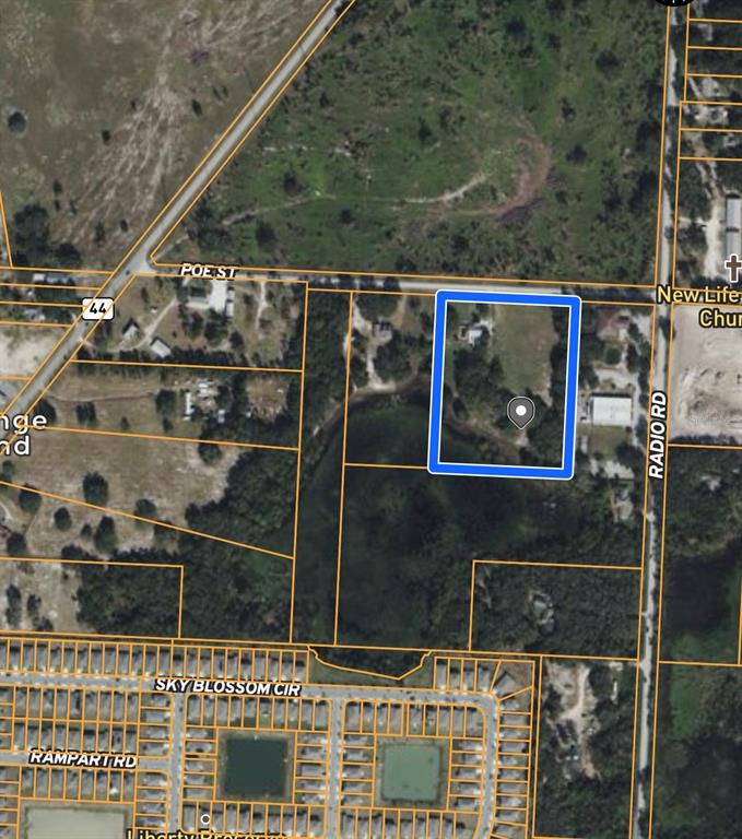 9844 Poe Street Leesburg, FL 34788 - Photo 9 of 32 a bird view of a house