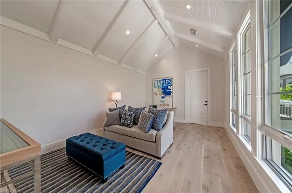 a living room with furniture and a rug