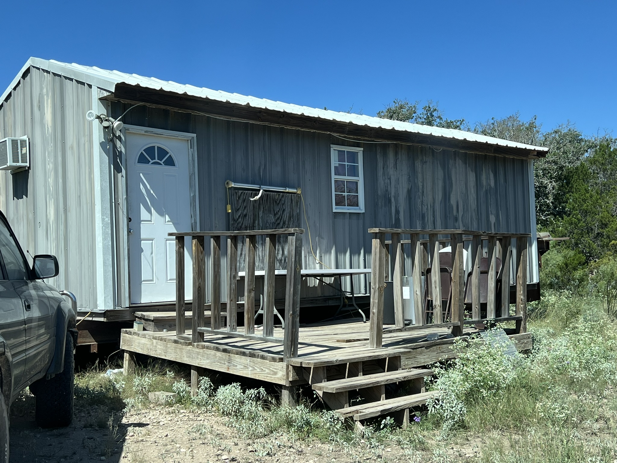 450 County Road 450 Rocksprings, TX 78880 - Photo 11 of 22 a view of house with wooden deck front door