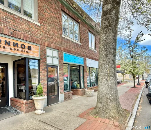 a view of a building with a tree