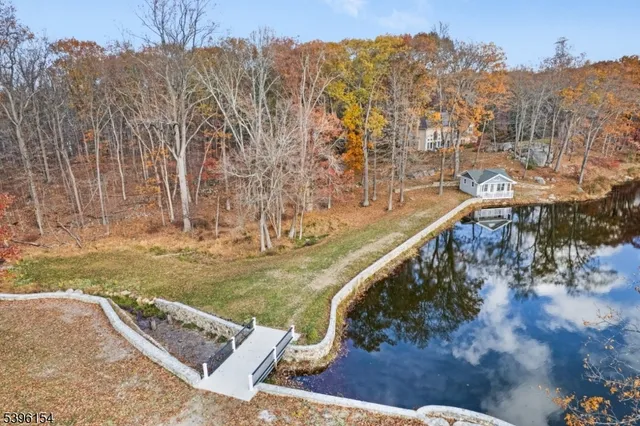 a view of a swimming pool with a yard