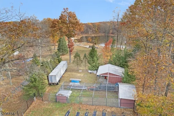 a view of a wooden deck and a backyard