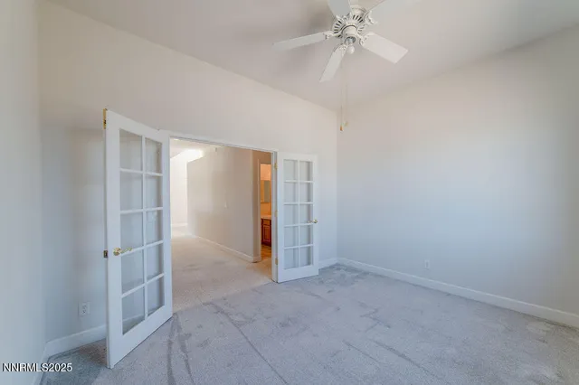 a spacious bathroom with a granite countertop sink a toilet and a bathtub