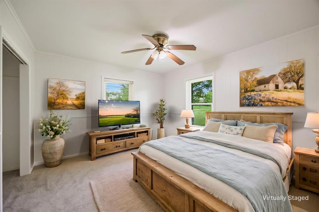 571 South 1st Street Point, TX 75472 - Photo 15 of 27 a bedroom with a bed and a flat screen tv