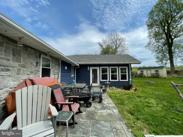 a backyard of a house with seating space
