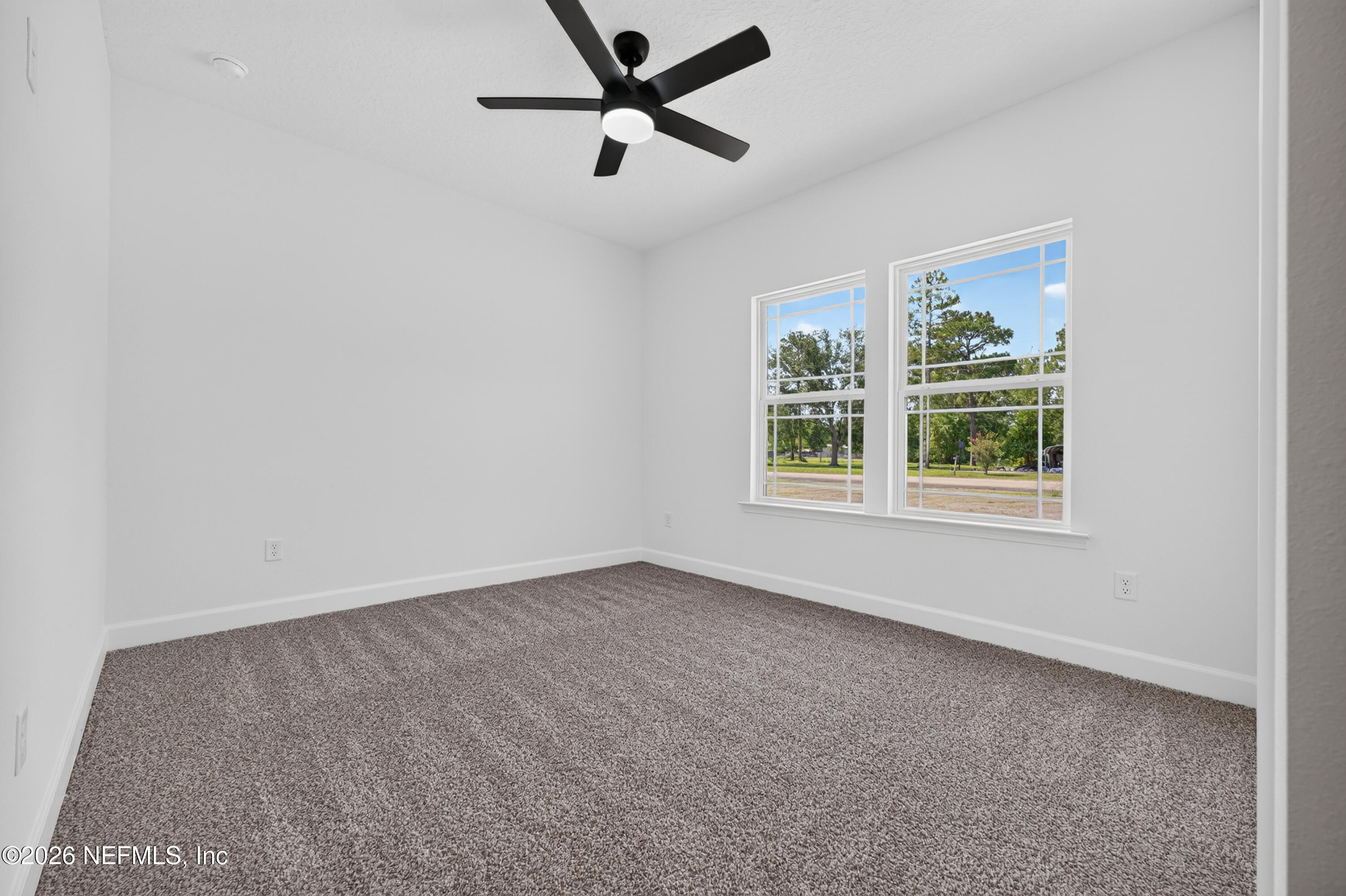 4362 Angora Street Middleburg, FL 32068 - Photo 16 of 31 an empty room with windows and ceiling fan