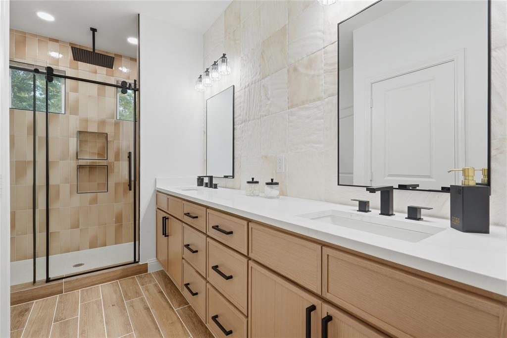 2150 Lakeview Mabank, TX 75156 - Photo 20 of 36 a bathroom with a double vanity sink mirror and shower