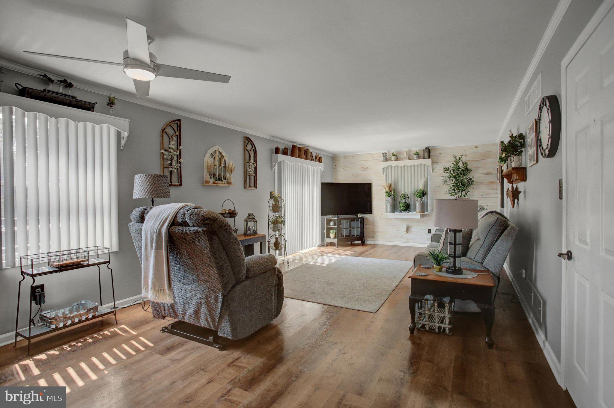 11086 Welsh Run Road Greencastle, PA 17225 - Photo 23 of 63 a living room with furniture and a flat screen tv