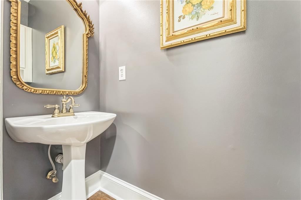 411 Chelsea Circle Northeast Atlanta, GA 30307 - Photo 21 of 42 a bathroom with a sink and a mirror