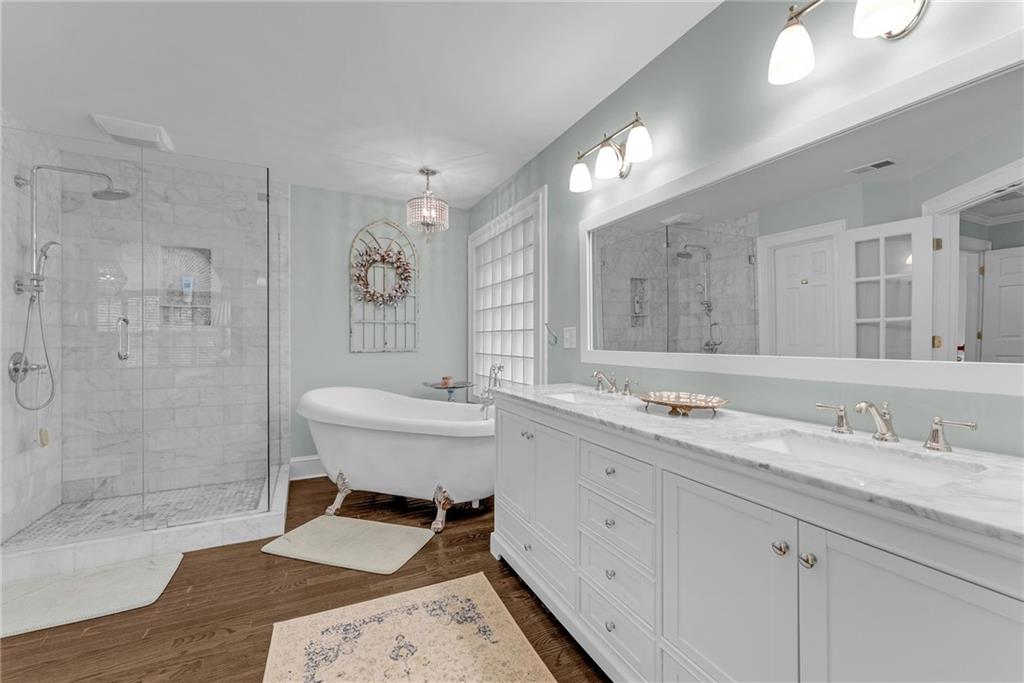 411 Chelsea Circle Northeast Atlanta, GA 30307 - Photo 24 of 42 a bathroom with a sink and a mirror