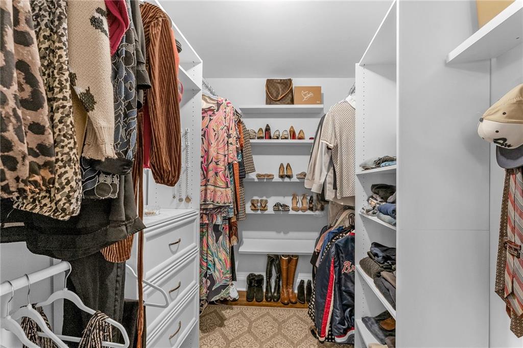 411 Chelsea Circle Northeast Atlanta, GA 30307 - Photo 26 of 42 a view of walk in closet with clothes and shoes