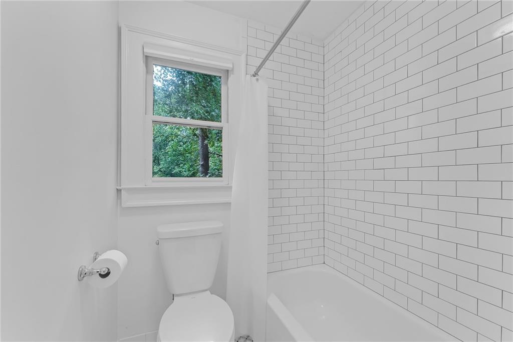 411 Chelsea Circle Northeast Atlanta, GA 30307 - Photo 33 of 42 a bathroom with a toilet and a shower