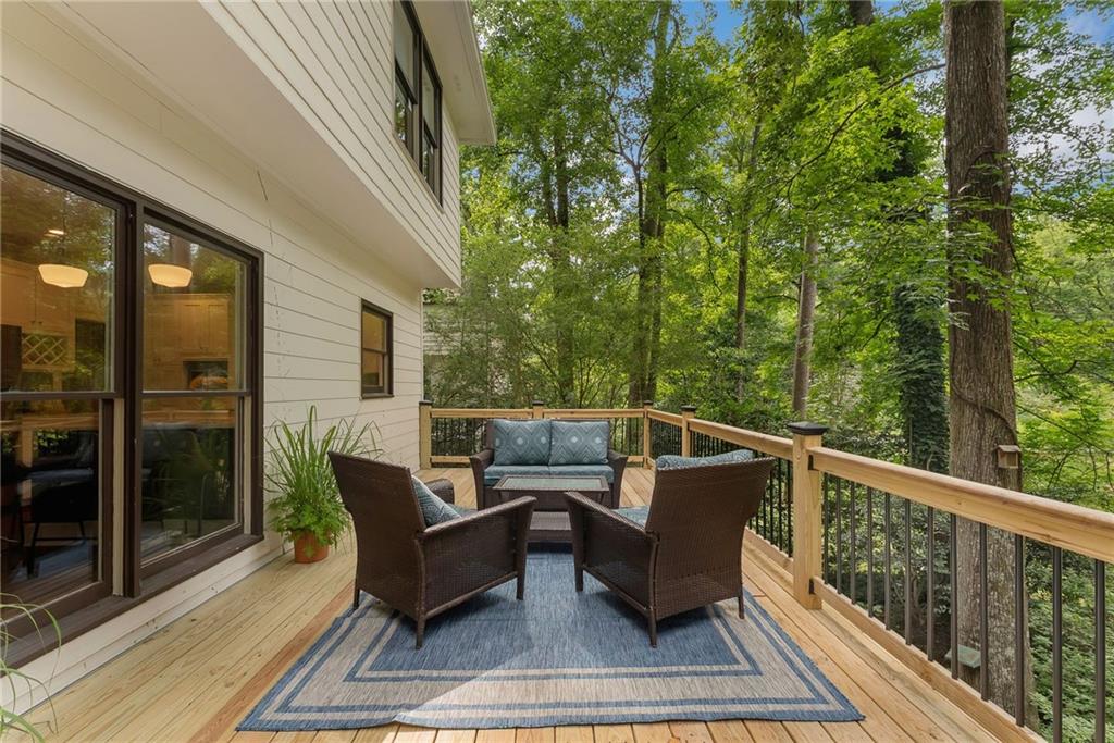 411 Chelsea Circle Northeast Atlanta, GA 30307 - Photo 37 of 42 a roof deck with couches and wooden floor