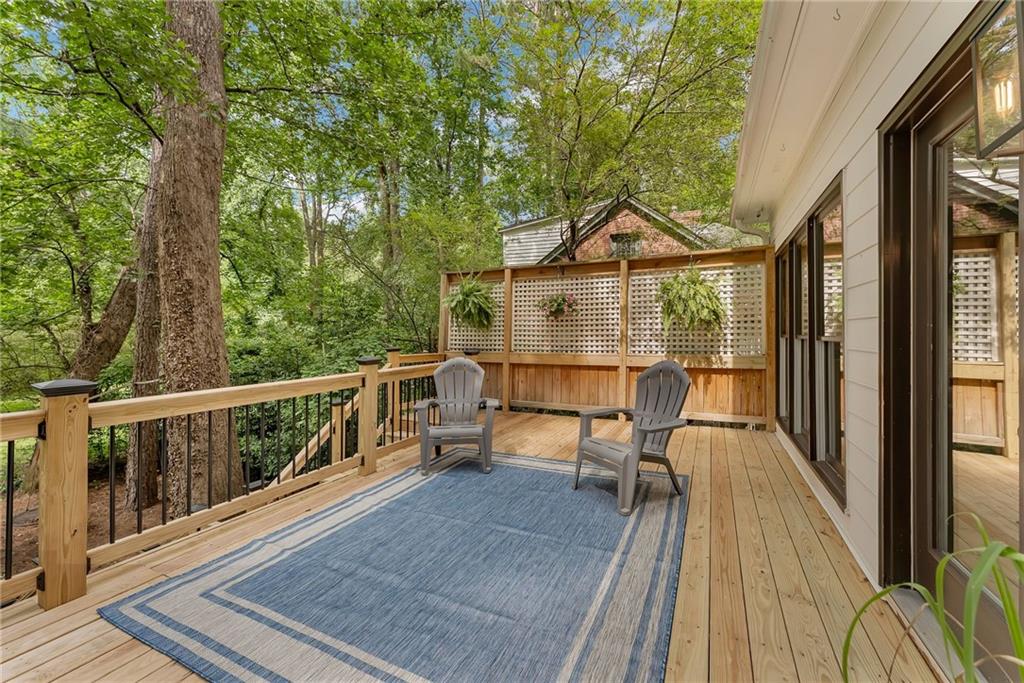 411 Chelsea Circle Northeast Atlanta, GA 30307 - Photo 39 of 42 a view of a balcony with chairs and wooden floor