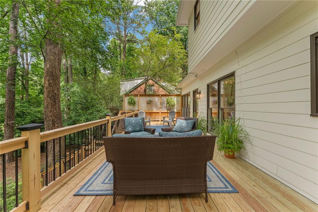 411 Chelsea Circle Northeast Atlanta, GA 30307 - Photo 40 of 42 a view of a house with backyard sitting area and garden