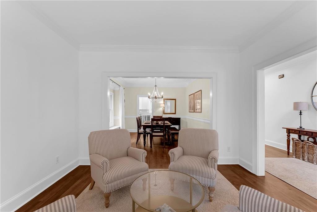 411 Chelsea Circle Northeast Atlanta, GA 30307 - Photo 7 of 42 a living room with furniture and a dining table