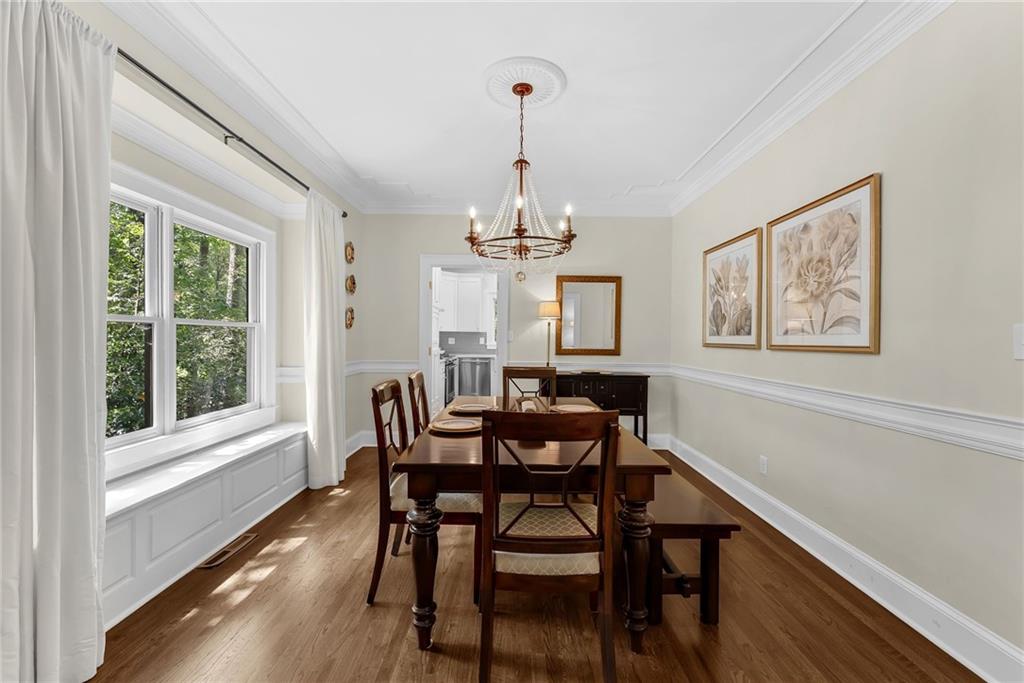 411 Chelsea Circle Northeast Atlanta, GA 30307 - Photo 10 of 42 a view of a dining room with furniture window and wooden floor