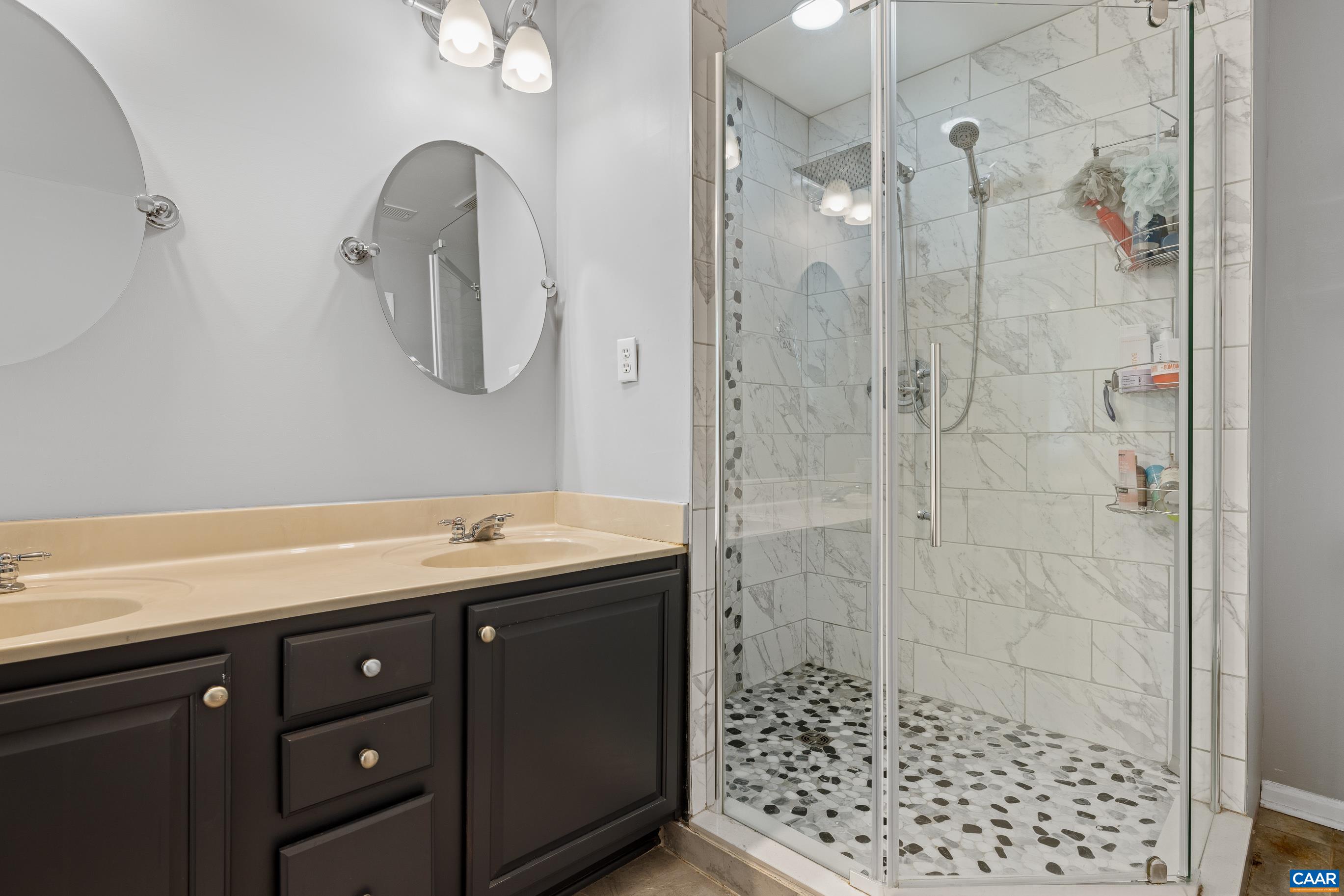 20 Zephyr Road Palmyra, VA 22963 - Photo 33 of 43 a bathroom with a granite countertop sink a mirror and shower