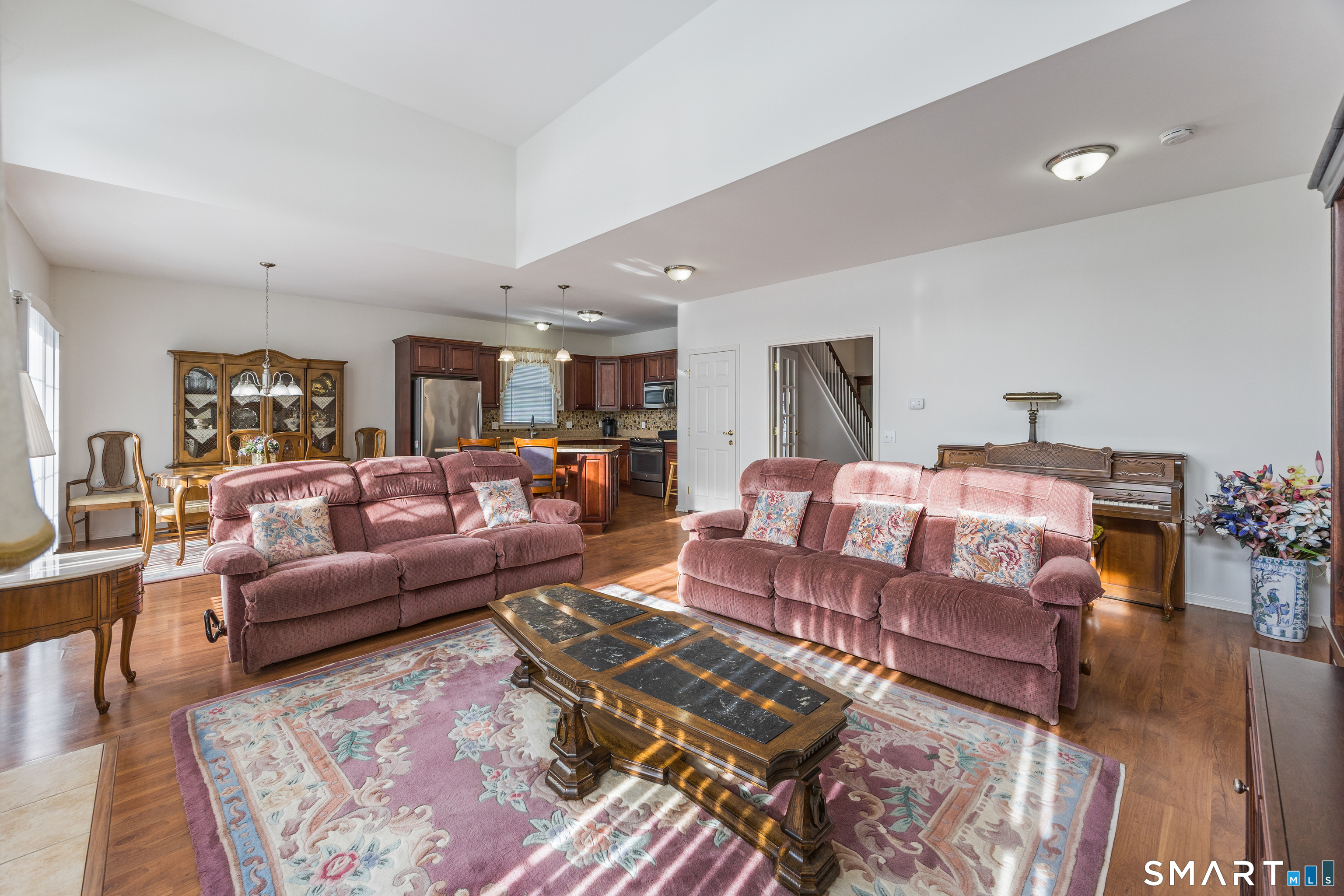 39 Phillips Farm Road, Unit 39 East Hartford, CT 06118 - Photo 16 of 32 a living room with furniture and wooden floor