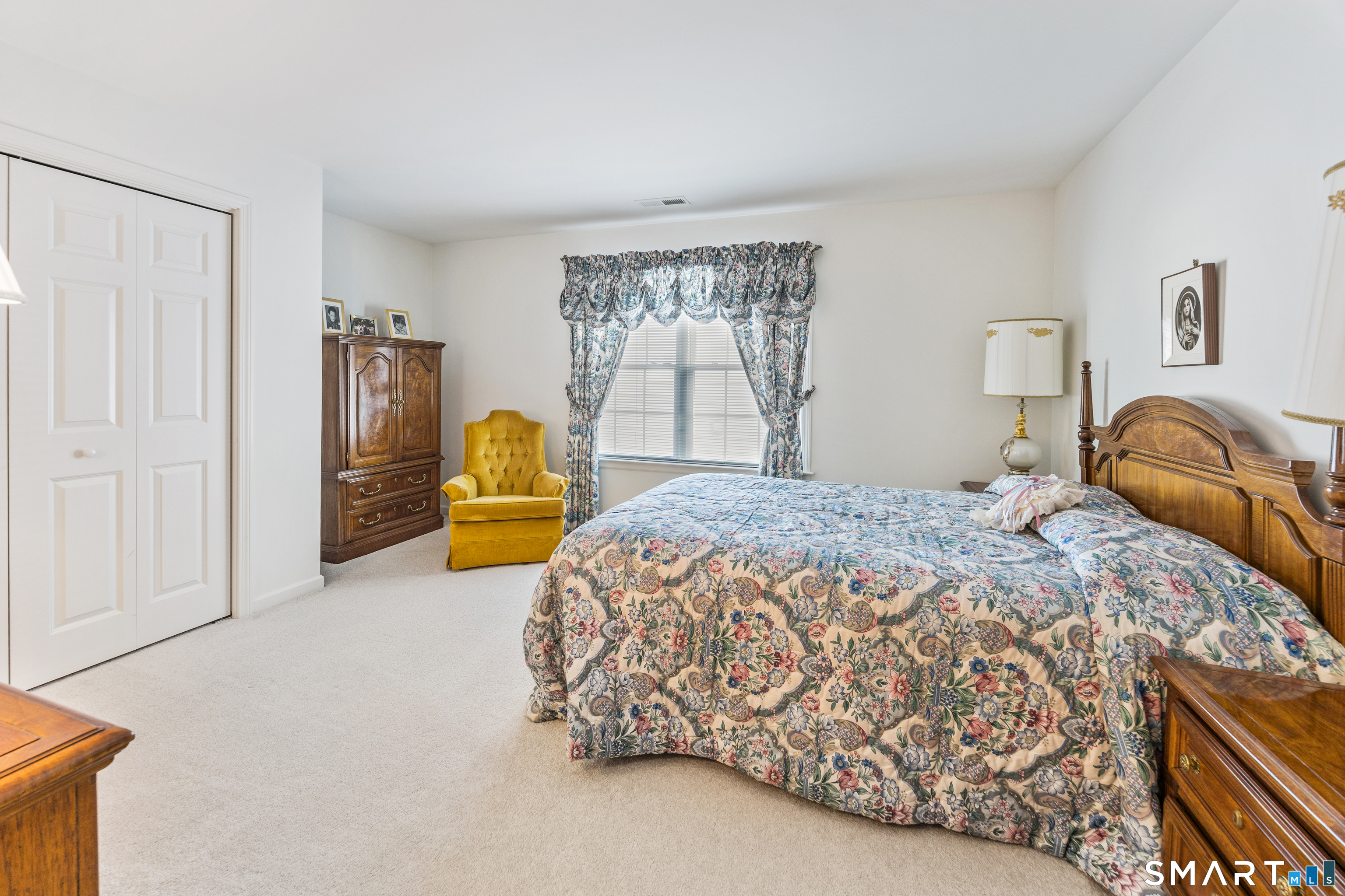 39 Phillips Farm Road, Unit 39 East Hartford, CT 06118 - Photo 21 of 32 a bedroom with a bed and window