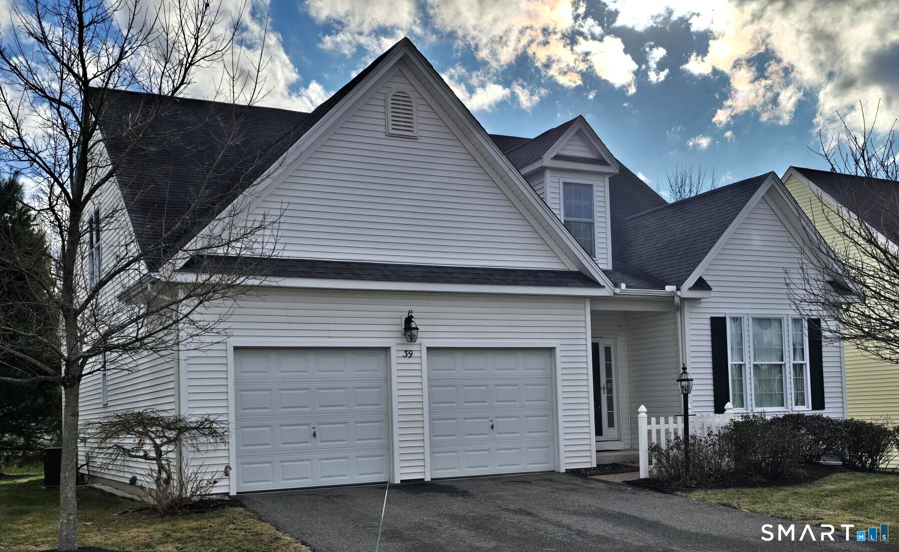 39 Phillips Farm Road, Unit 39 East Hartford, CT 06118 - Photo 30 of 32 a view of a house with a yard