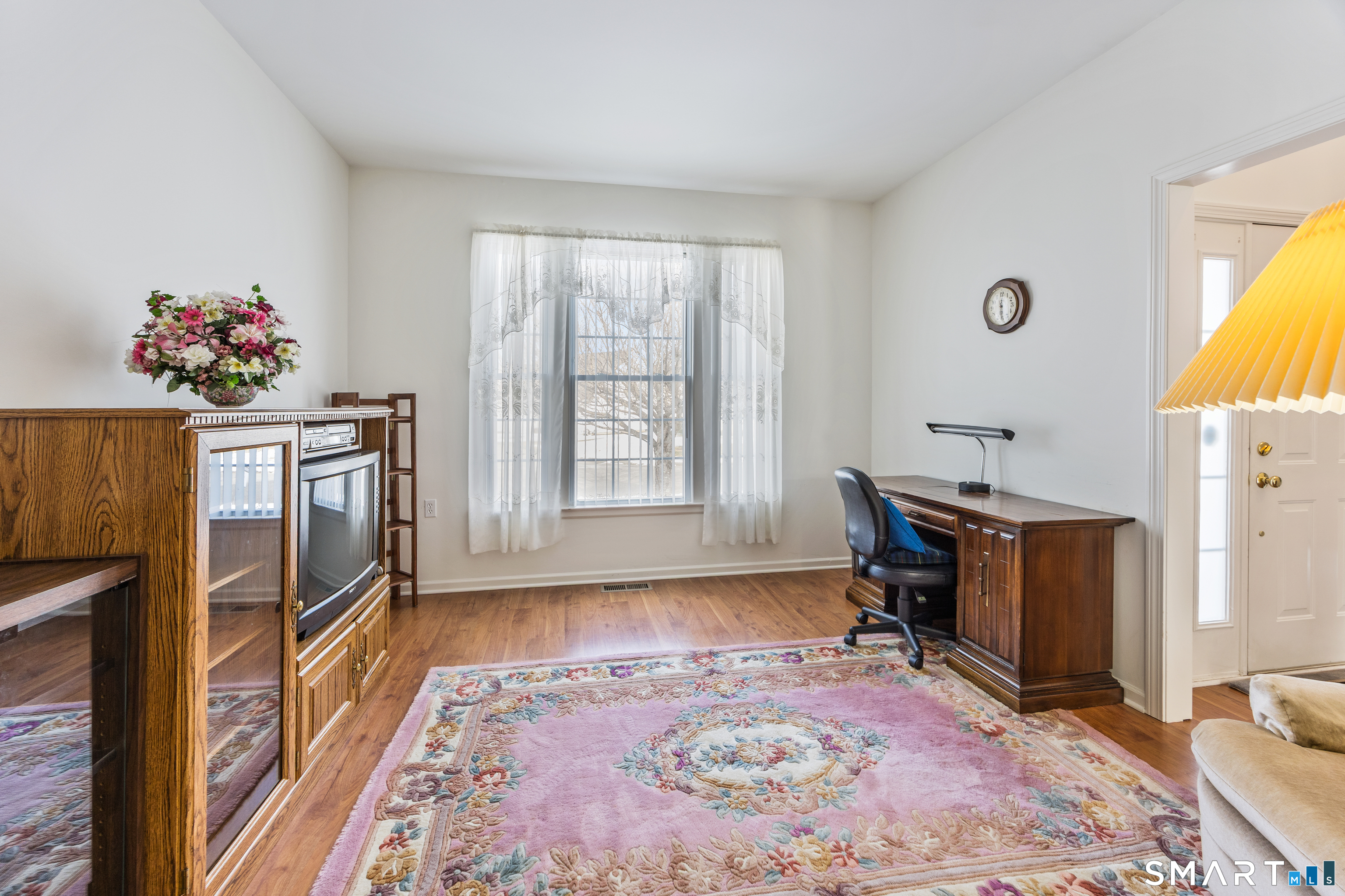 39 Phillips Farm Road, Unit 39 East Hartford, CT 06118 - Photo 8 of 32 a view of a workspace with furniture and a window
