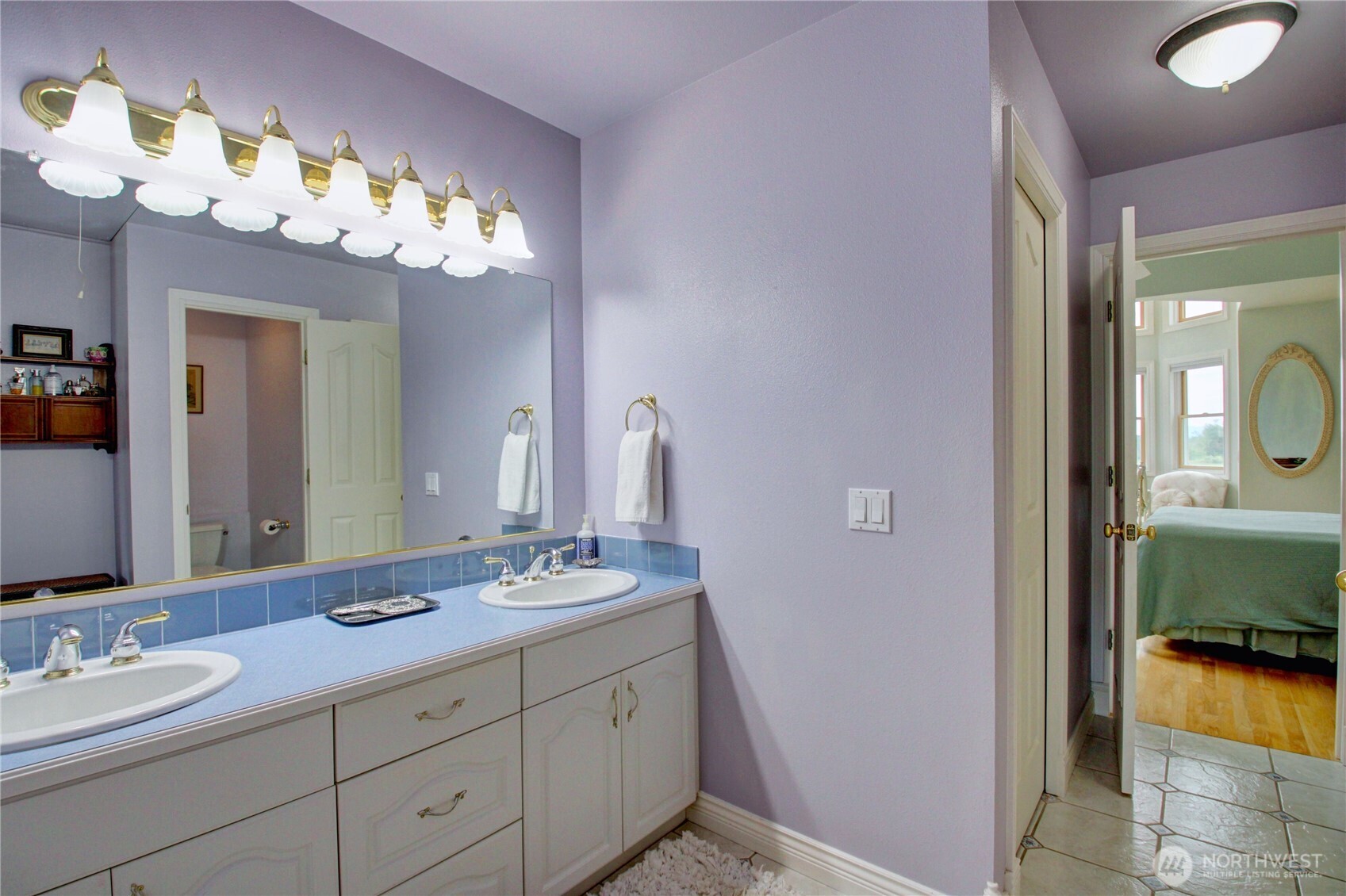 2950 Aldergrove Road Ferndale, WA 98248 - Photo 24 of 39 a bathroom with a double vanity sink and a mirror