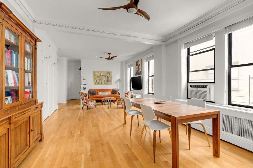 790 Riverside Drive, Unit 12K Manhattan, NY 10032 - Photo 5 of 11 a view of a dining room with furniture window and wooden floor