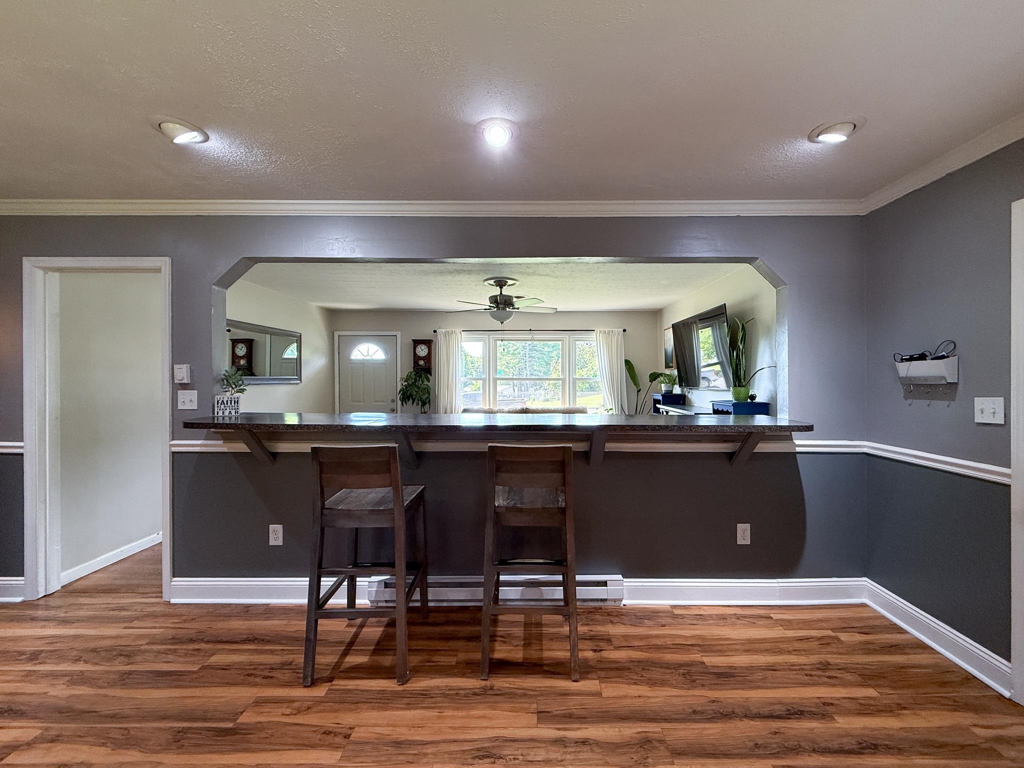 39 View Drive Stuarts Draft, VA 24477 - Photo 14 of 25 a kitchen with granite countertop a table chairs and wooden floor