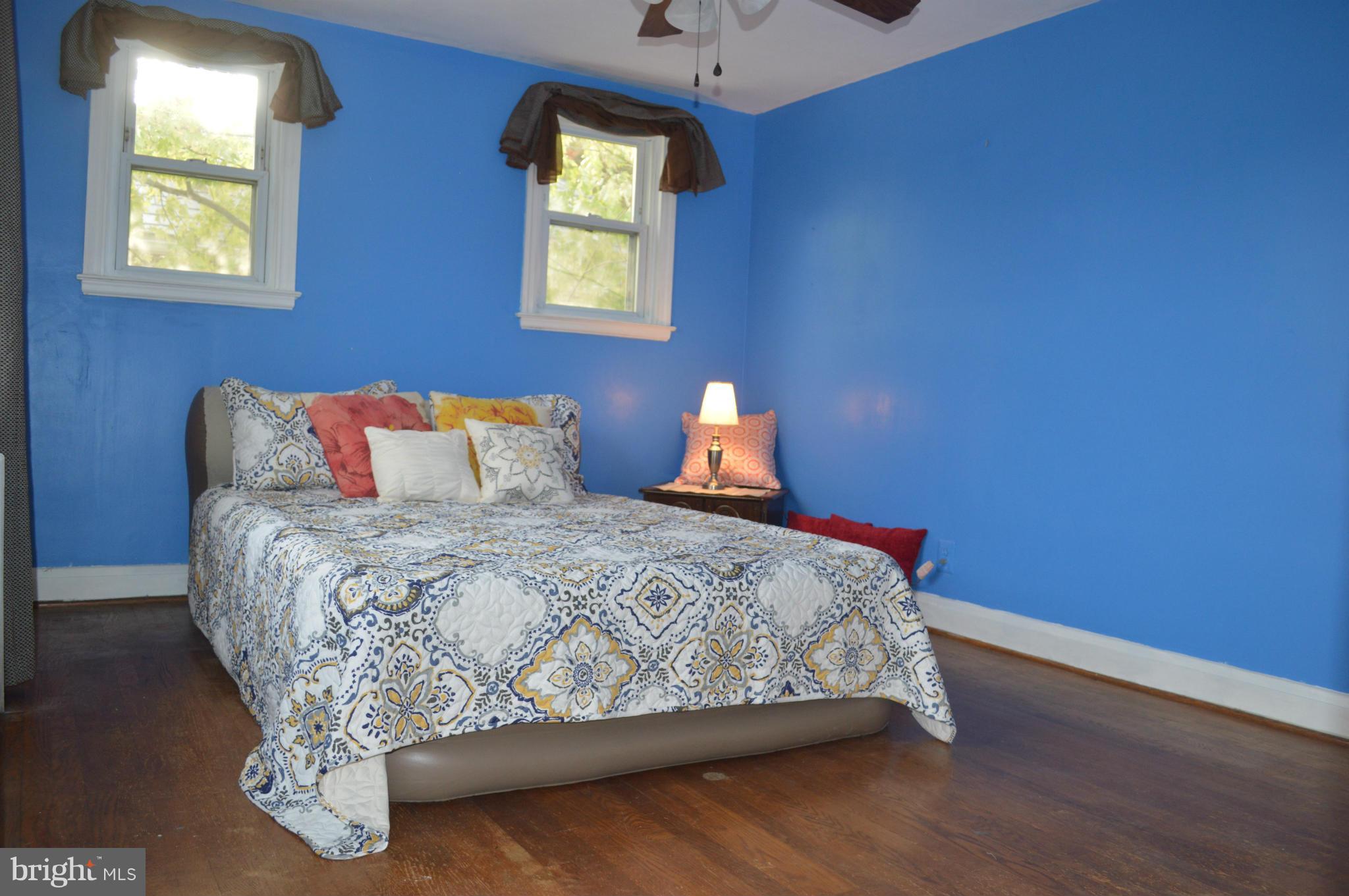746 Charing Cross Road Baltimore, MD 21229 - Photo 12 of 30 a bed sitting in a bedroom next to a window