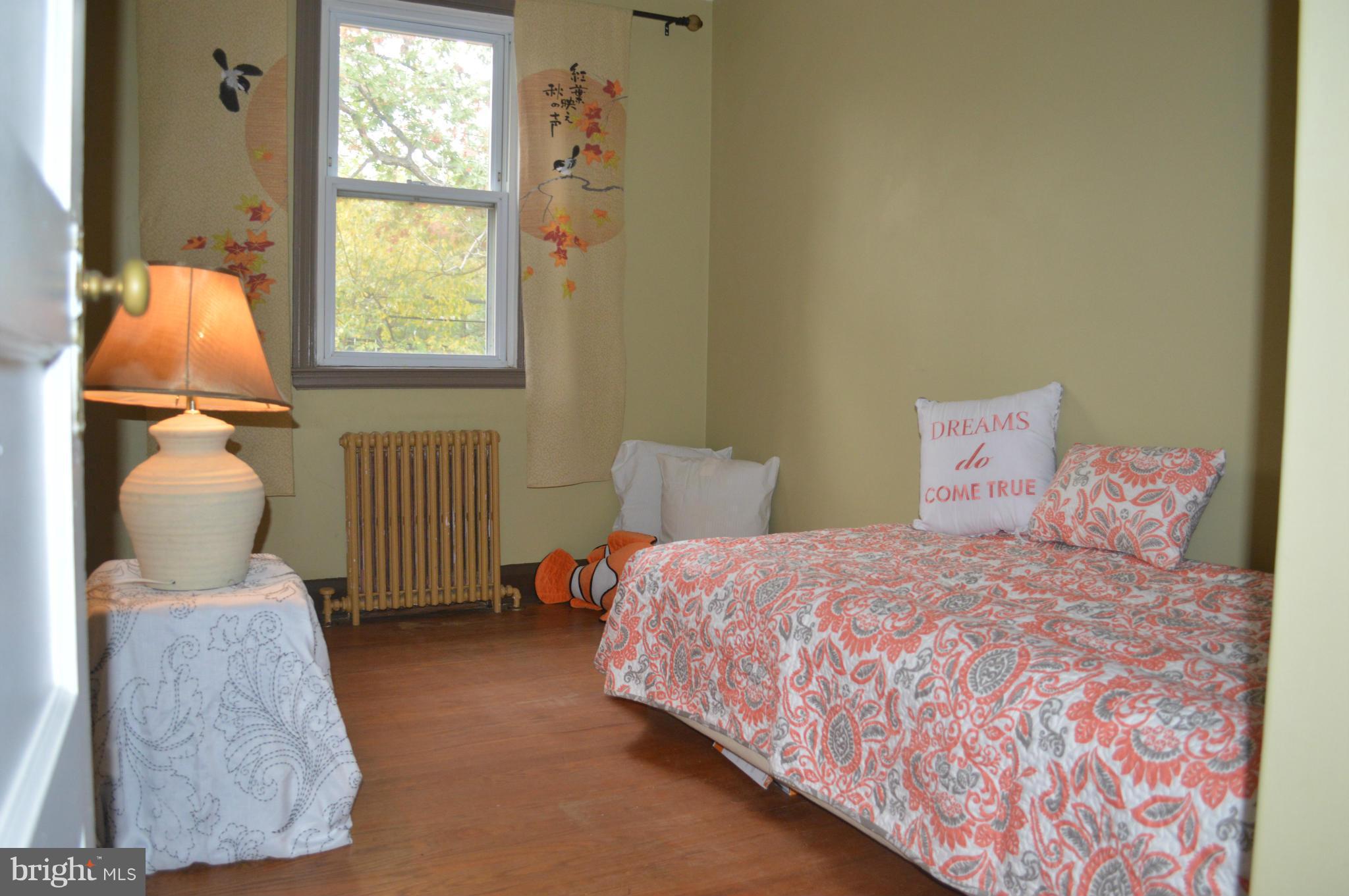 746 Charing Cross Road Baltimore, MD 21229 - Photo 17 of 30 a bedroom with a bed and window