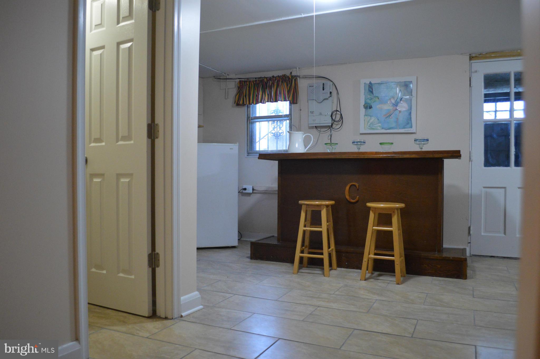 746 Charing Cross Road Baltimore, MD 21229 - Photo 22 of 30 a view of a livingroom with an entryway and fireplace