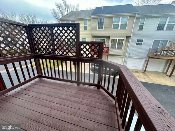 a view of an empty room and a window