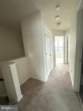 an empty room with windows and view