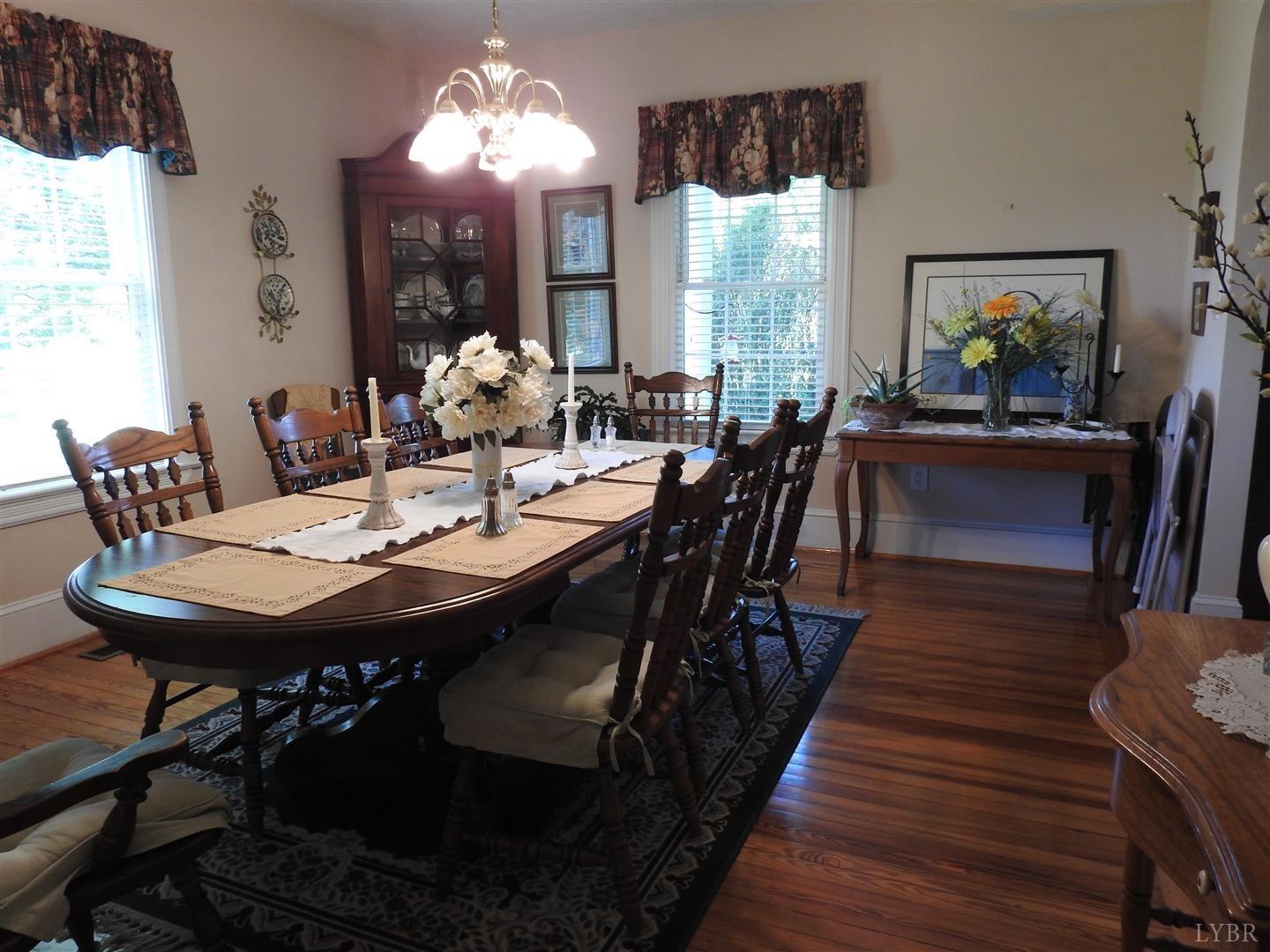 5537 Goode Road Goode, VA 24556 - Photo 5 of 56 a view of a dining room with furniture and chandelier