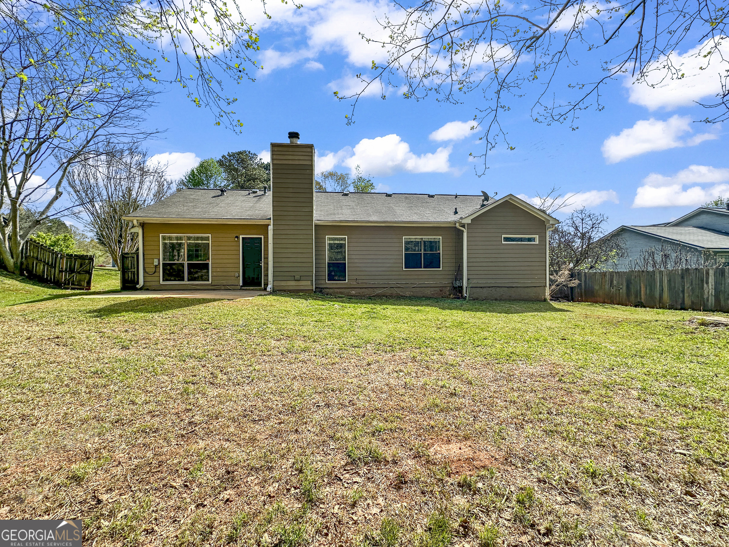 11647 Matthews Trail Hampton, GA 30228 - Photo 16 of 18 a view of a house with a yard