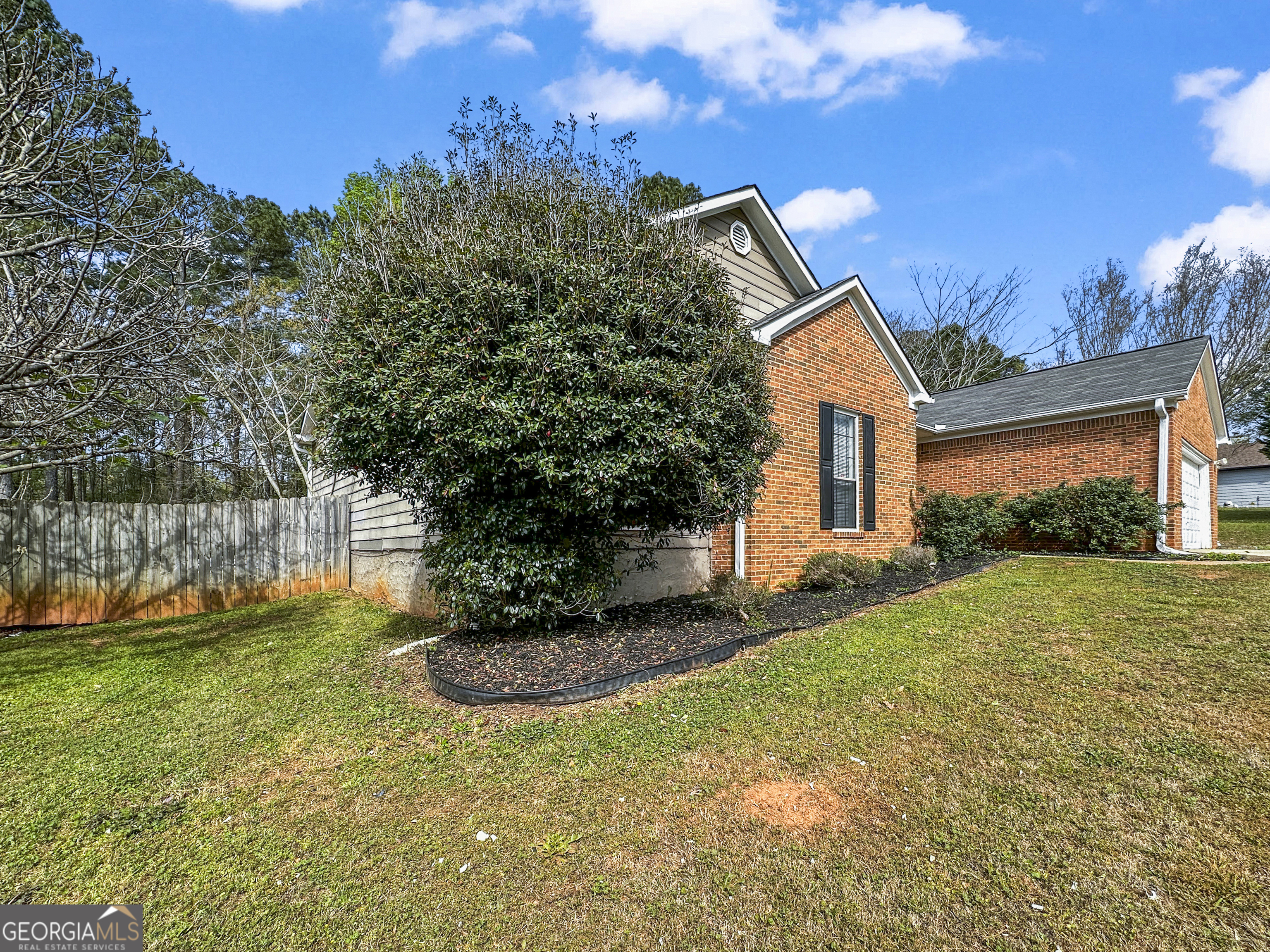 11647 Matthews Trail Hampton, GA 30228 - Photo 3 of 18 a view of a house with backyard and garden