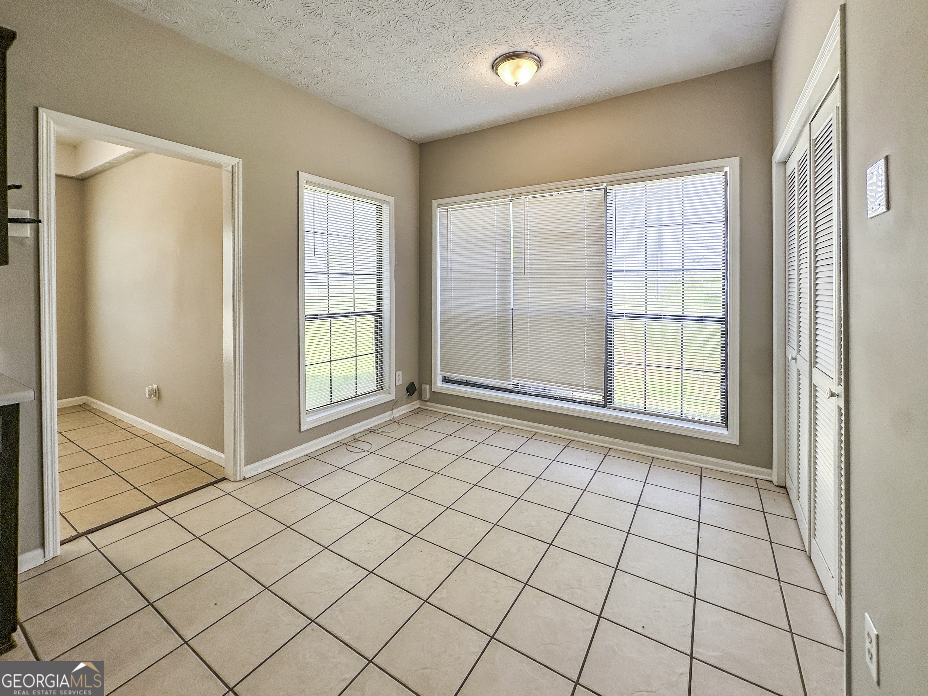 11647 Matthews Trail Hampton, GA 30228 - Photo 6 of 18 a view of an empty room and window
