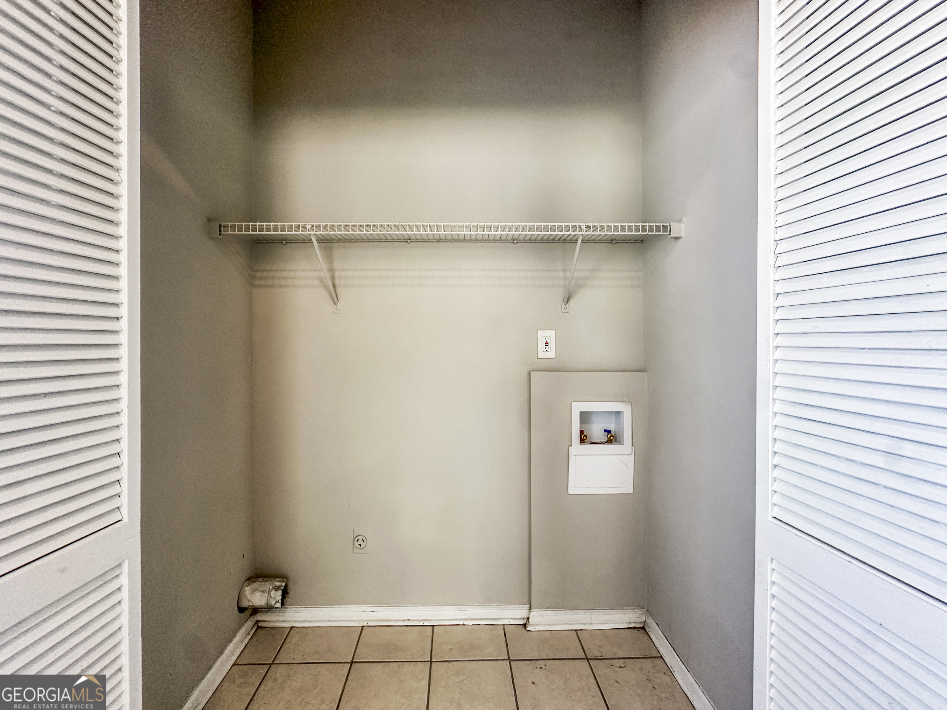 11647 Matthews Trail Hampton, GA 30228 - Photo 8 of 18 a view of an empty walk in closet