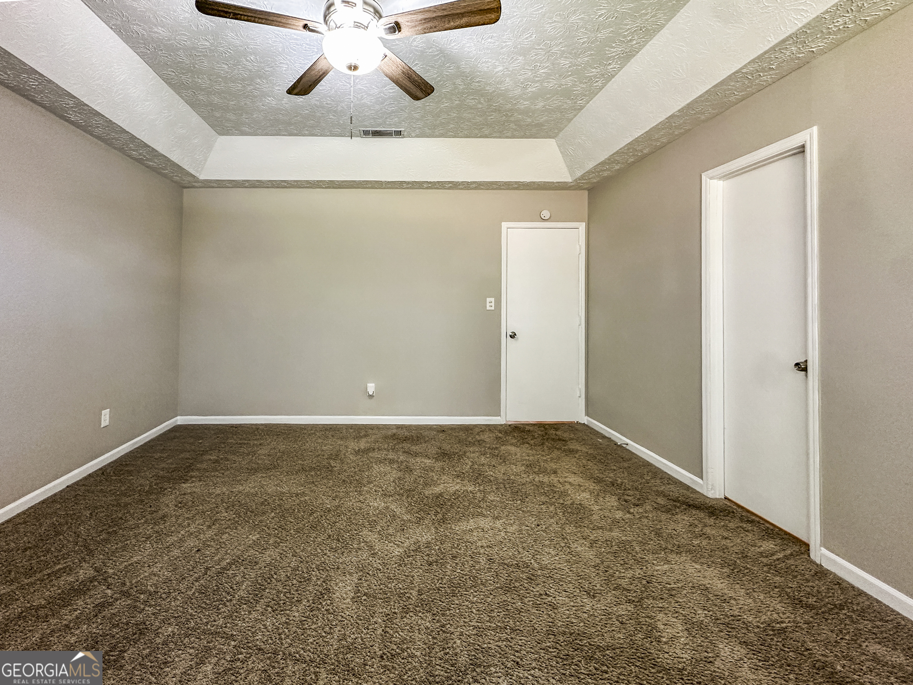 11647 Matthews Trail Hampton, GA 30228 - Photo 10 of 18 a view of an empty room