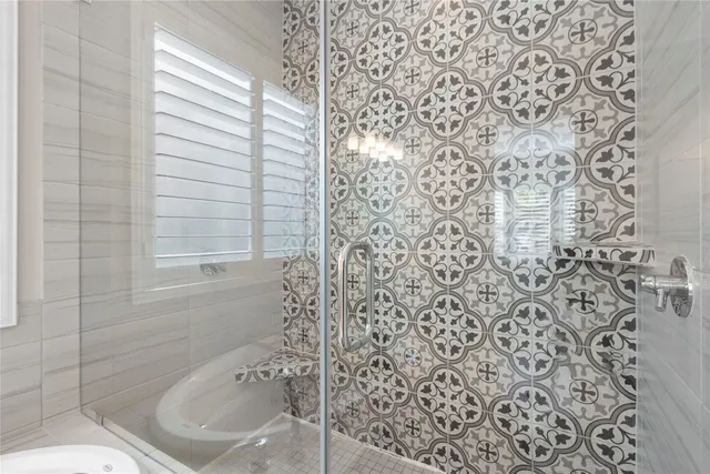 a bathroom with a bathtub and shower