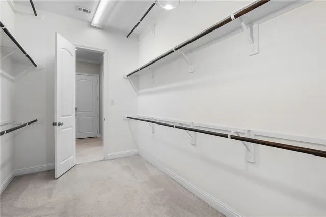 a view of an empty walk in closet