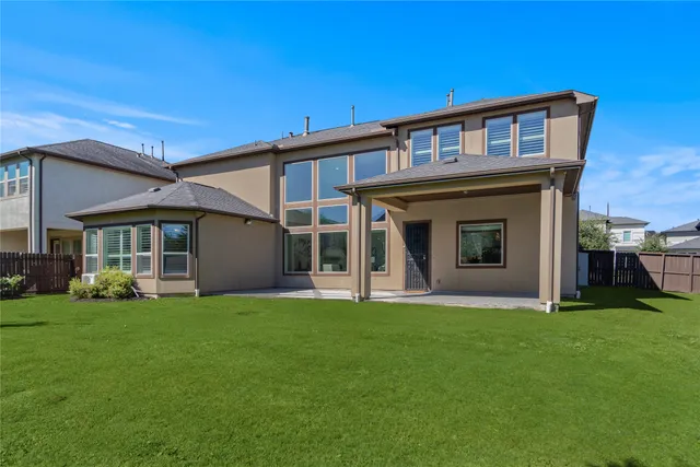 a view of a kitchen with a sink and a large window