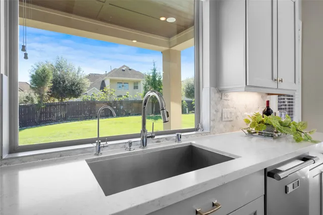 a view of yard with swimming pool and green space