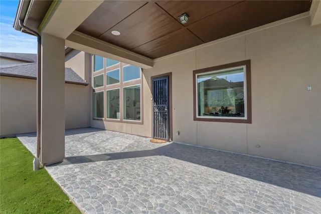 a front view of a house with a yard and porch