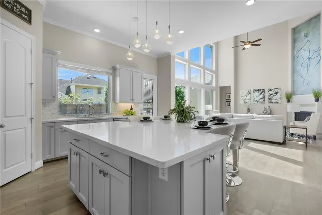 a kitchen with counter top space a sink cabinets and appliances
