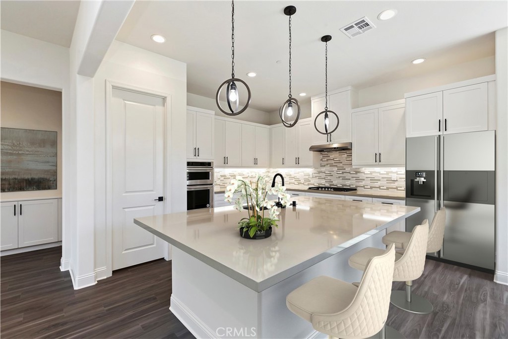 1265 Crownview Terrace Riverside, CA 92506 - Photo 1 of 1 a kitchen with stainless steel appliances granite countertop a sink a stove and cabinets